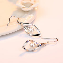 Twisted Pearl Earrings with Tassel Design