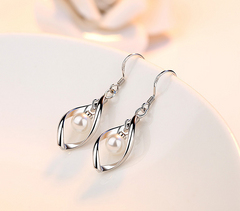 Twisted Pearl Earrings with Tassel Design
